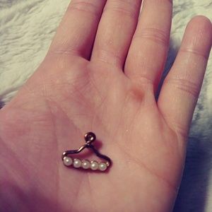 Gold plated "clothes hanger" charm